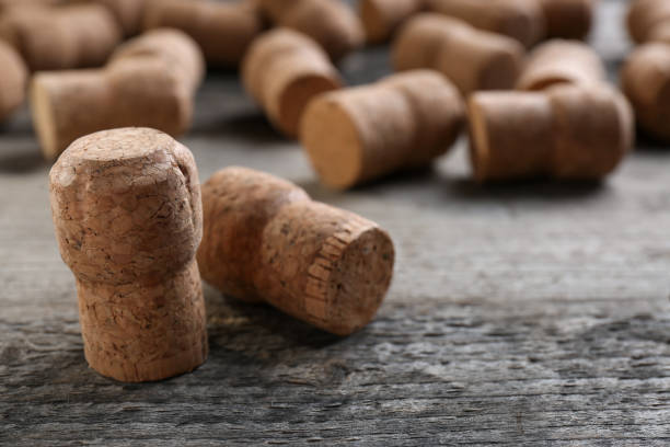 istock Sparkling wine bottle corks on wooden table, closeup 1735988418