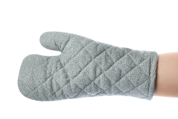 istock Chef in oven glove on white background, closeup 1735990036