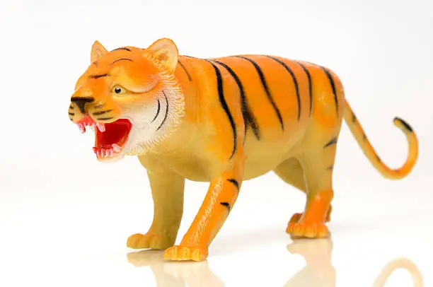 Photo of Fierce Orange Yellow Tiger Toy on White Background, Cat, Mascot