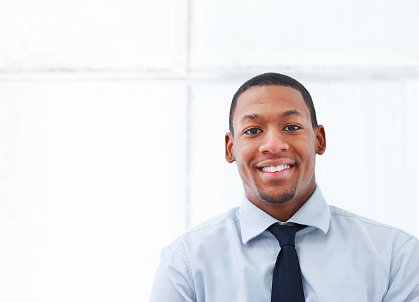 istock Male smiling in a blue shirt and black tie 173599392