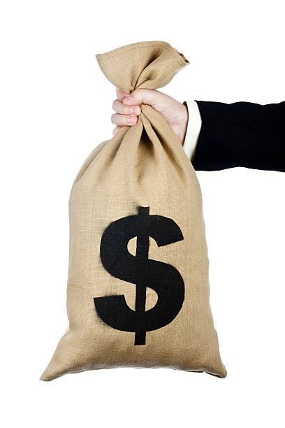 istock Bag of US dollars held in hand 173599605