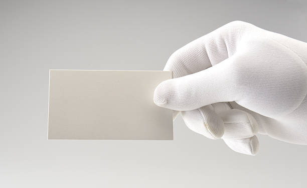 White card/white gloved hand/copy space White gloved hand holding white card with room for copy formal glove stock pictures, royalty-free photos & images