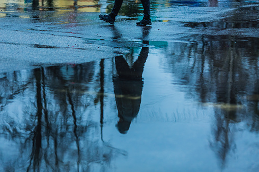 Puddle on asphalt. Rainy weather.