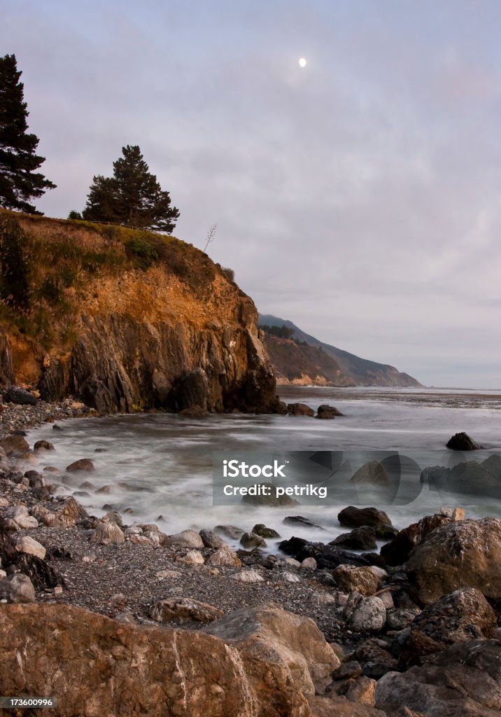 Rocky coastline and moon at dusk "Pacific coastline and moon at dusk in Big Sur, California" Big Sur Stock Photo