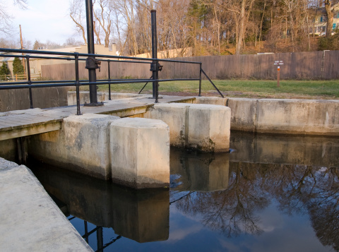 The D+R (Delaware and Raritan) Canal was a major shipping channel back in the day for NJ.  Now it's just a great place to go for a walk.  This is one of the few remaining locks that would help raise and lower the barges.  You can get the feelings of control and strength from this scene