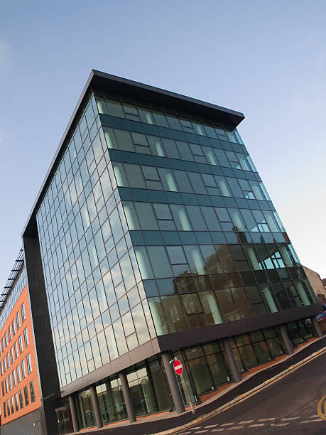 istock New, empty glass office building waiting a tenant. 173602775