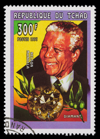1997 Chad postage stamp with a picture of Nelson Mandela and a large diamond.