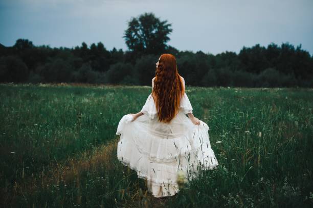 istock Girl in the field 1736030102