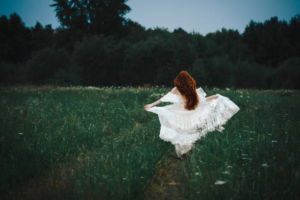 istock Girl in the field 1736030112