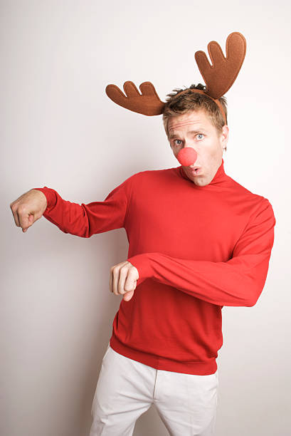 istock Red-Nosed Reindeer Man Prances at White Wall 173603118