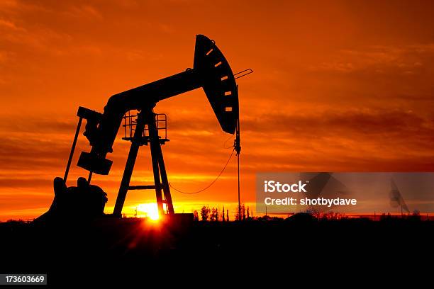 Pumpjack As The Sunrises Stock Photo - Download Image Now - Geologist, Oil Pump, Fuel and Power Generation