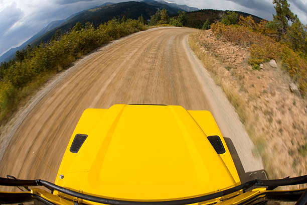 Motion shot of Jeep on dirt road