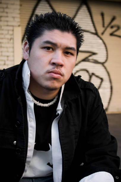 istock 20s Asian Young Man Urban Portrait with Graffiti Outside 173603997