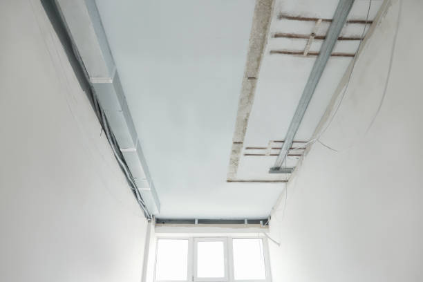 istock Ceiling with wires prepared for renovation in room 1736056097