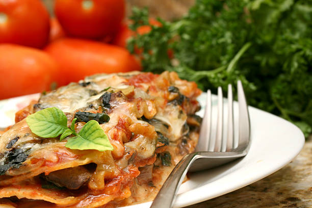 istock Delicious lasagna served on a white plate with garnish  173605709