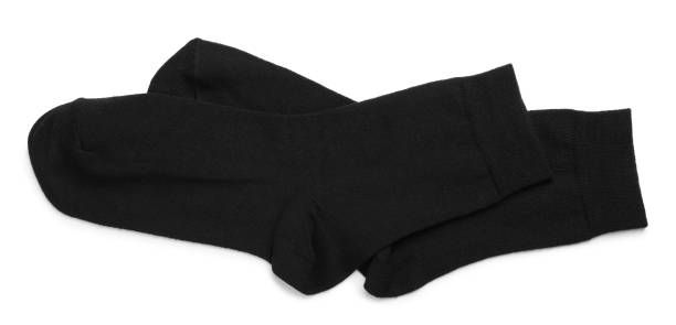 istock Pair of black socks on white background, top view 1736063067