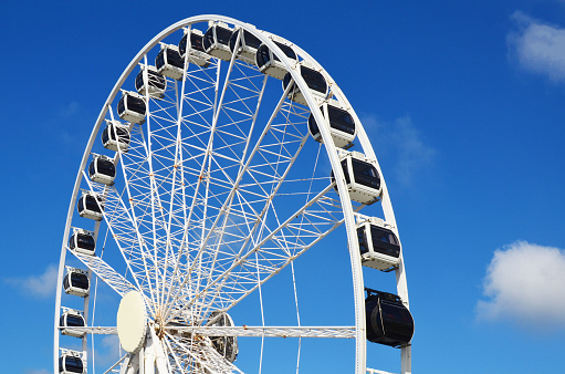 Beautiful large Ferris wheel against blue sky