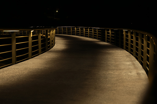 View of modern bridge in city at night