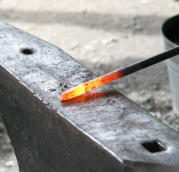 A red hot iron rod on silver metal