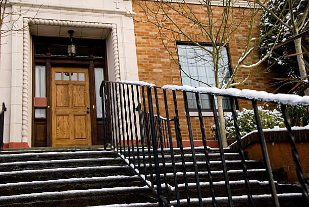 istock Front steps of residence with snow on handrail 173606770