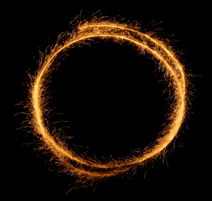 Round frame made of sparkler trace. You can add your message inside. Isolated on black.