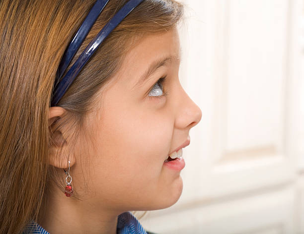 profile portrait of elementary age 8 year old girl.