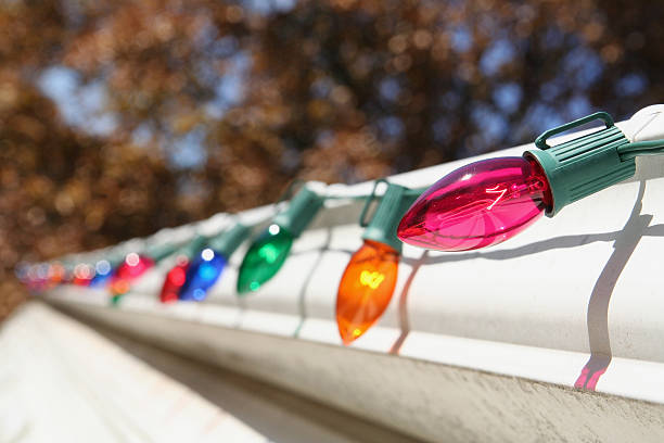 Christmas lights on the roofline of a home