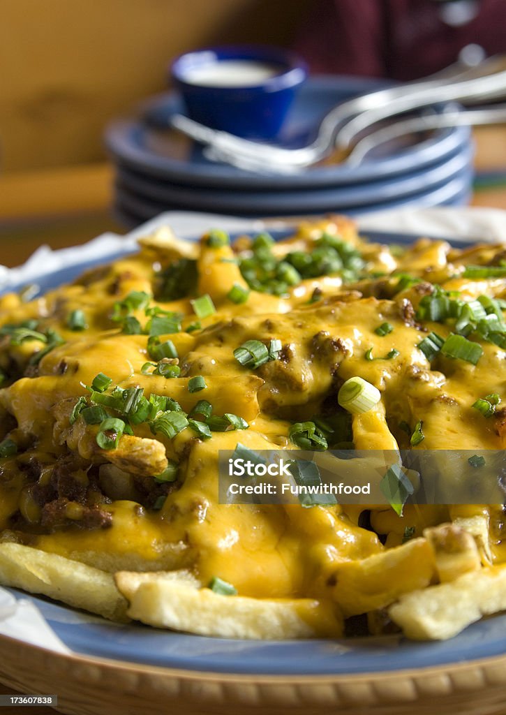 Cheddar Cheese French Fries, Melted Sauce on Chili "French fries topped with beef chili and melted cheddar cheese sauce with green onions. (SEE LIGHTBOXES BELOW for more appetizers, meals, snack food & vegetables photos...)" American Culture Stock Photo