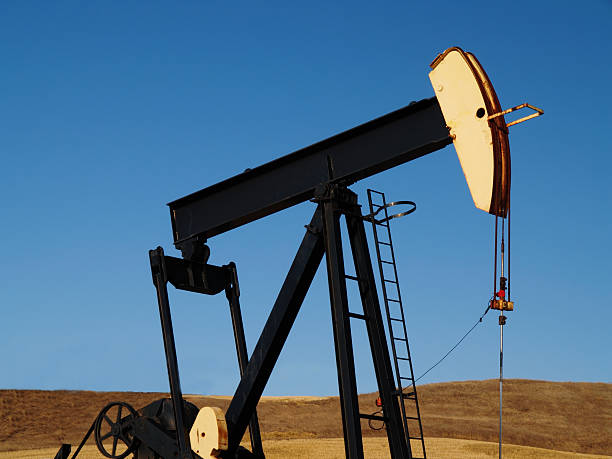 istock Black & Yellow Oil Well Pumpjack 173607884