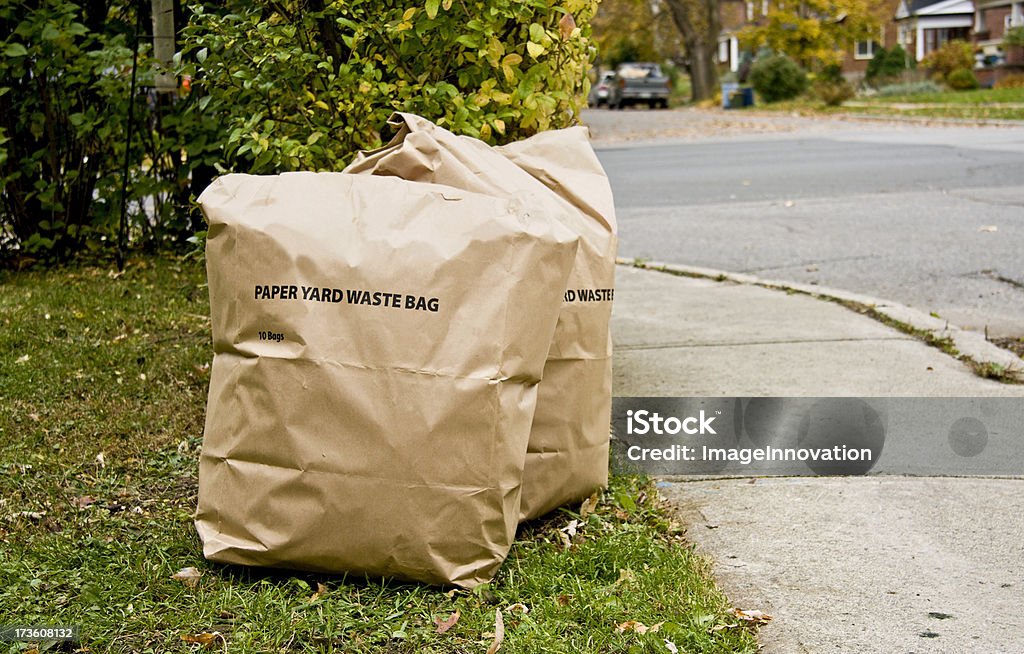 Paper Bags Of Yard Waste Beside Street Stock Photo - Download