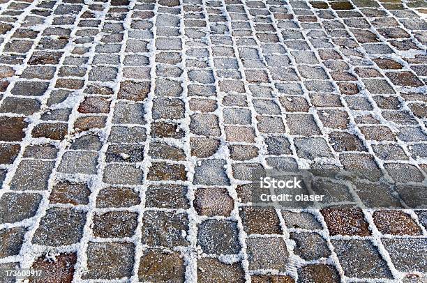 Cobblestones Framed By Frost Stock Photo - Download Image Now - City, Road, Snow