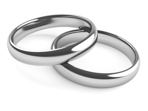 Two wedding rings linked together. Silver or Platinum
