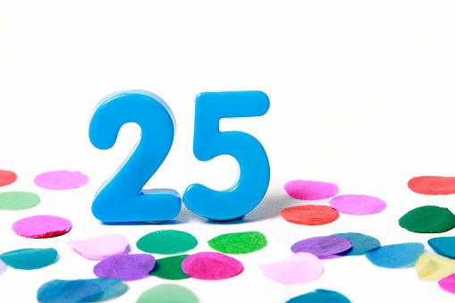 Bright blue 25 with colourful confetti aa shallow depth of field. Click to see more...