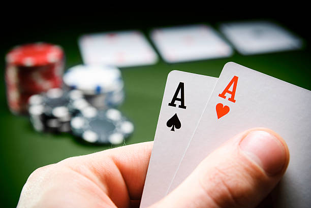 Winning Hand Having a good hand in a game of poker hand of cards stock pictures, royalty-free photos & images