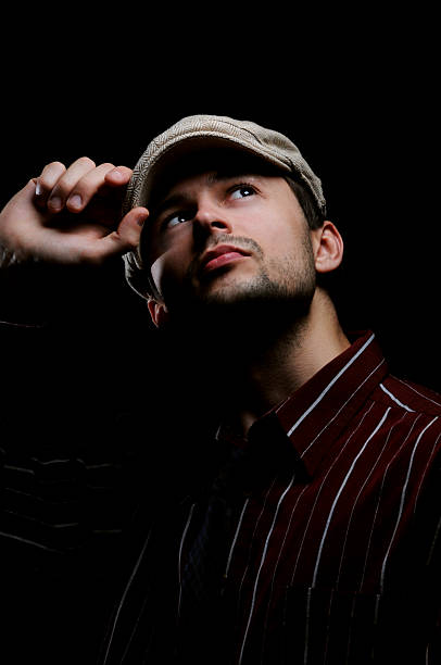 istock Holding Newsboy Cap 173610051