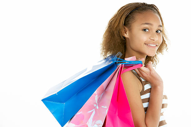 Teenage Girl Carrying Shopping Bags stock photo