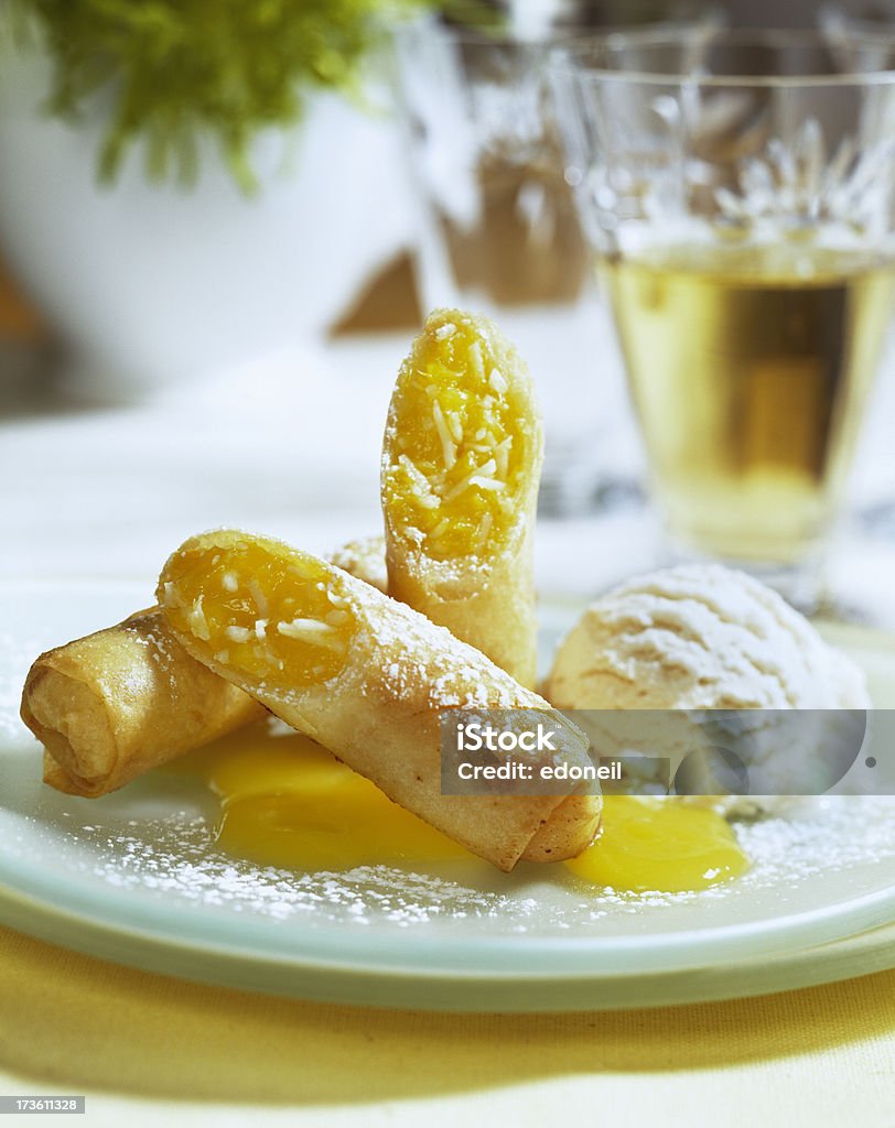 Mango coconut dessert rolls with ice cream Mango coconut dessert rolls with ice cream and wine Dairy Product Stock Photo