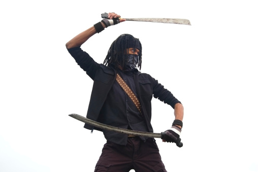With a blade in each hand this urban ninja is ready for action.Similar Shots: