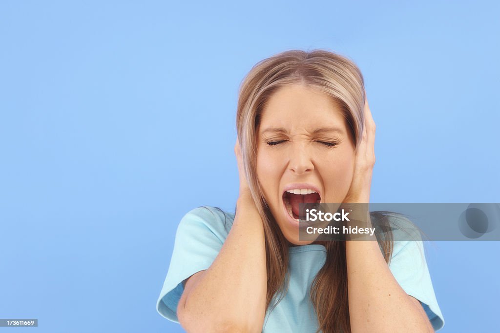 Too Much Noise Woman on blue 20-24 Years Stock Photo