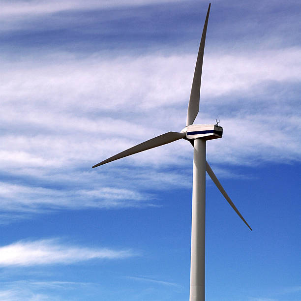 Wind Turbine Wind turbine against windy sky floating electric generator stock pictures, royalty-free photos & images