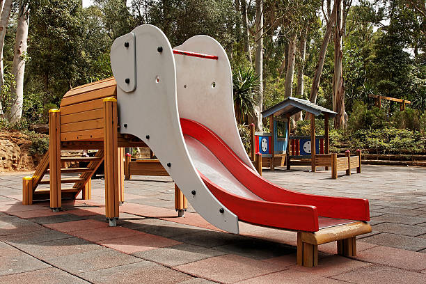 Elephant-shaped slide on a children's playground stock photo