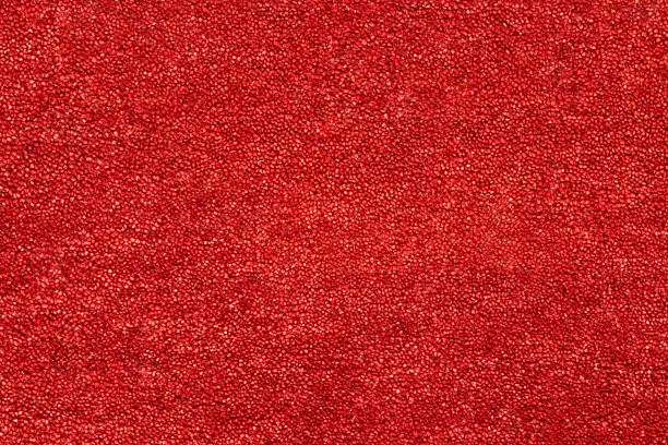 Photo of A closeup picture of a clean and bright red carpet