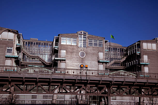 modern office building and historic railway bridge
