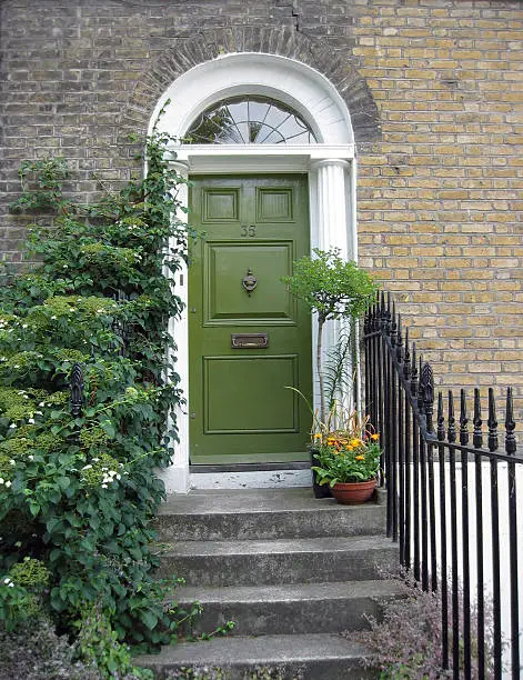 Steps leading to green front door (London)