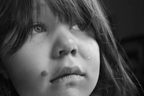 istock Grieving girl looks away 173614264