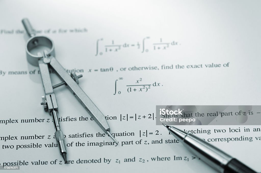 compass mechanical pencil and technical drawing compass on exam paper Blue Stock Photo