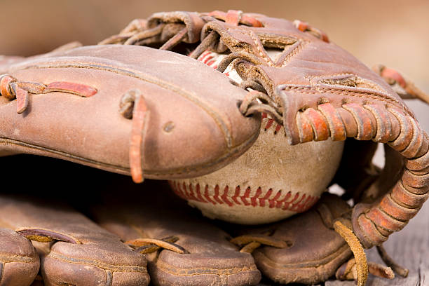 istock Worn baseball glove and ball 173614379