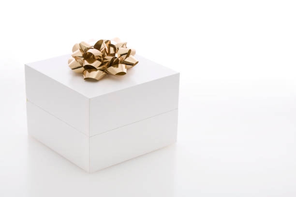 istock White Gift Box with Gold Colored Ribbon 173614915