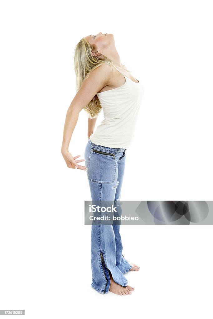 Stretching woman stretching her shoulders and eck. Full body. Isolated on white . 18-19 Years Stock Photo