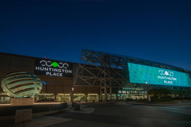 Huntington Place, the main convention center in downtown Detroit at night on a clear day in Detroit, Michigan. The  marquee shows the name of the venue, Huntington Place Huntington Place, the main convention center in downtown Detroit at night on a clear day in Detroit, Michigan. The  marquee shows the name of the venue, Huntington Place cobo hall photos stock pictures, royalty-free photos & images